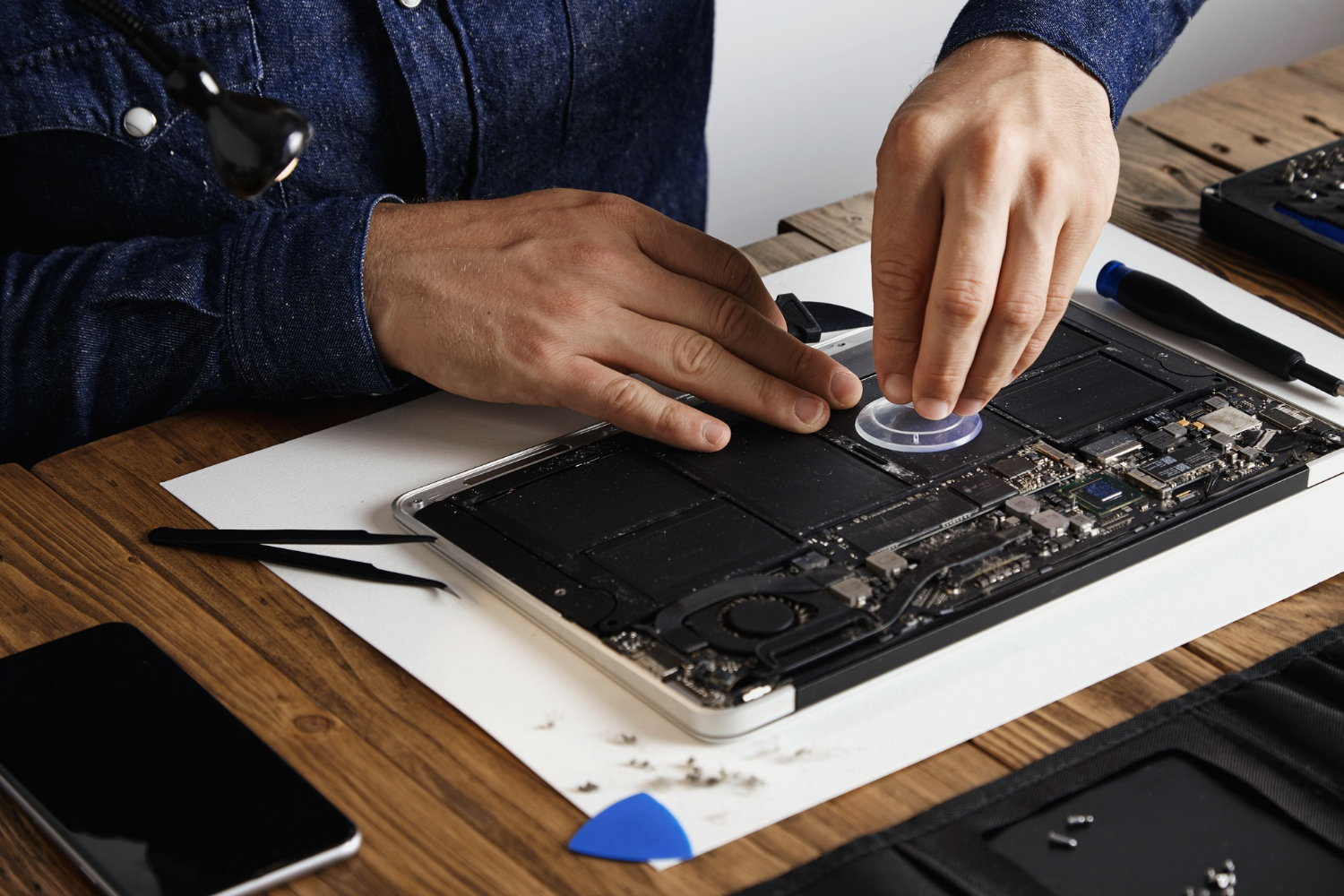 Computer technician repairing desktop hardware